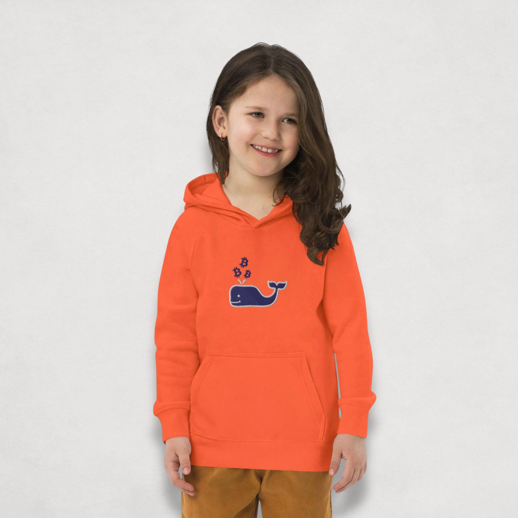 little girl wearing the orange Bitcoin Whale Kids Bitcoin Hoodie by lil'B