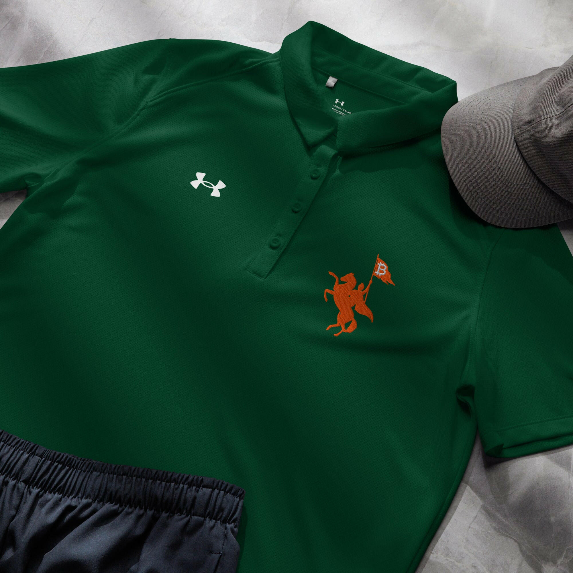 Soft Revolution / Under Armour® Women’s Bitcoin Polo - Nikki Nakamoto - The Orange Habit