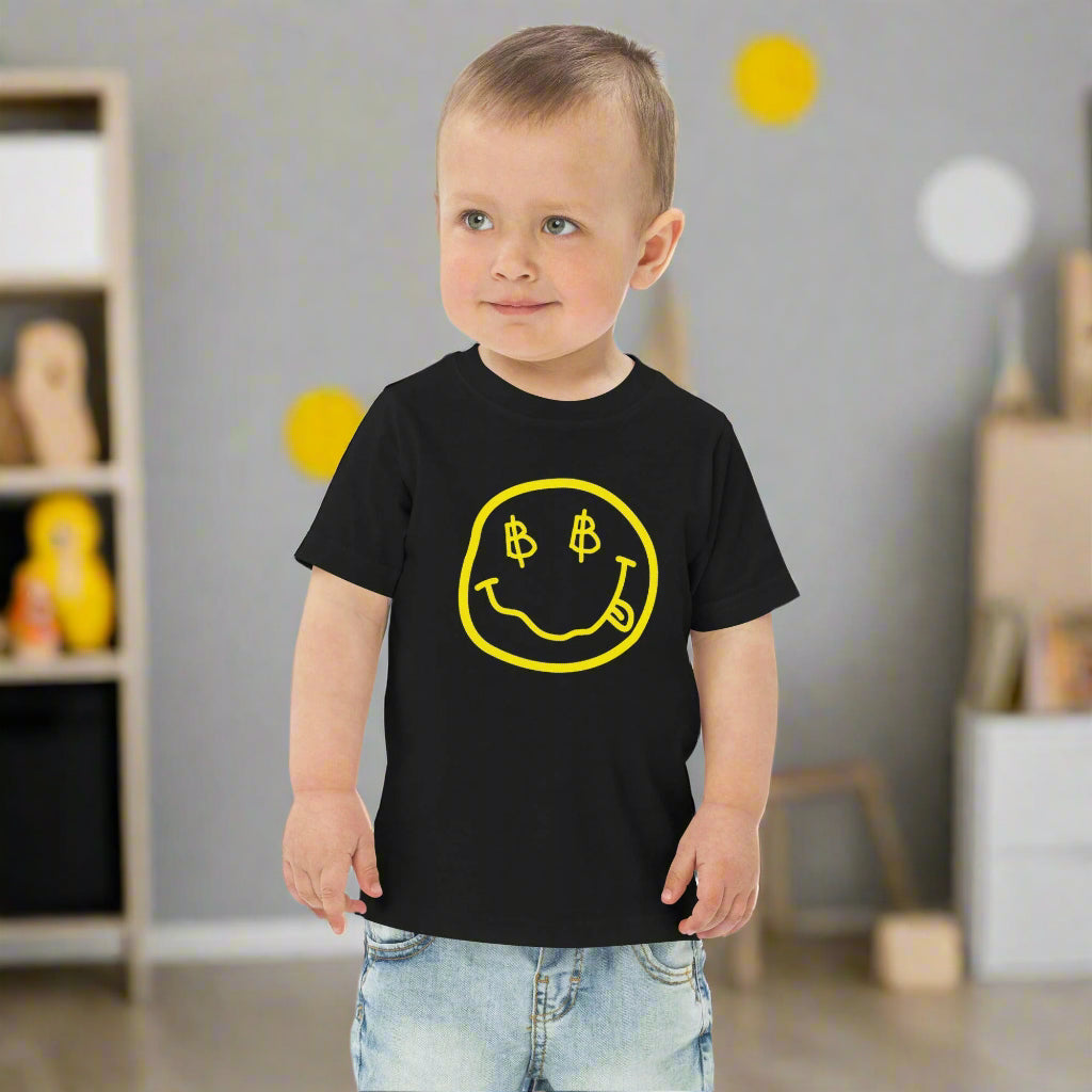 Toddler boy standing and wearing a Satoshi Smiles Black Toddler Bitcoin Tee - Lil'B - The Orange Habit