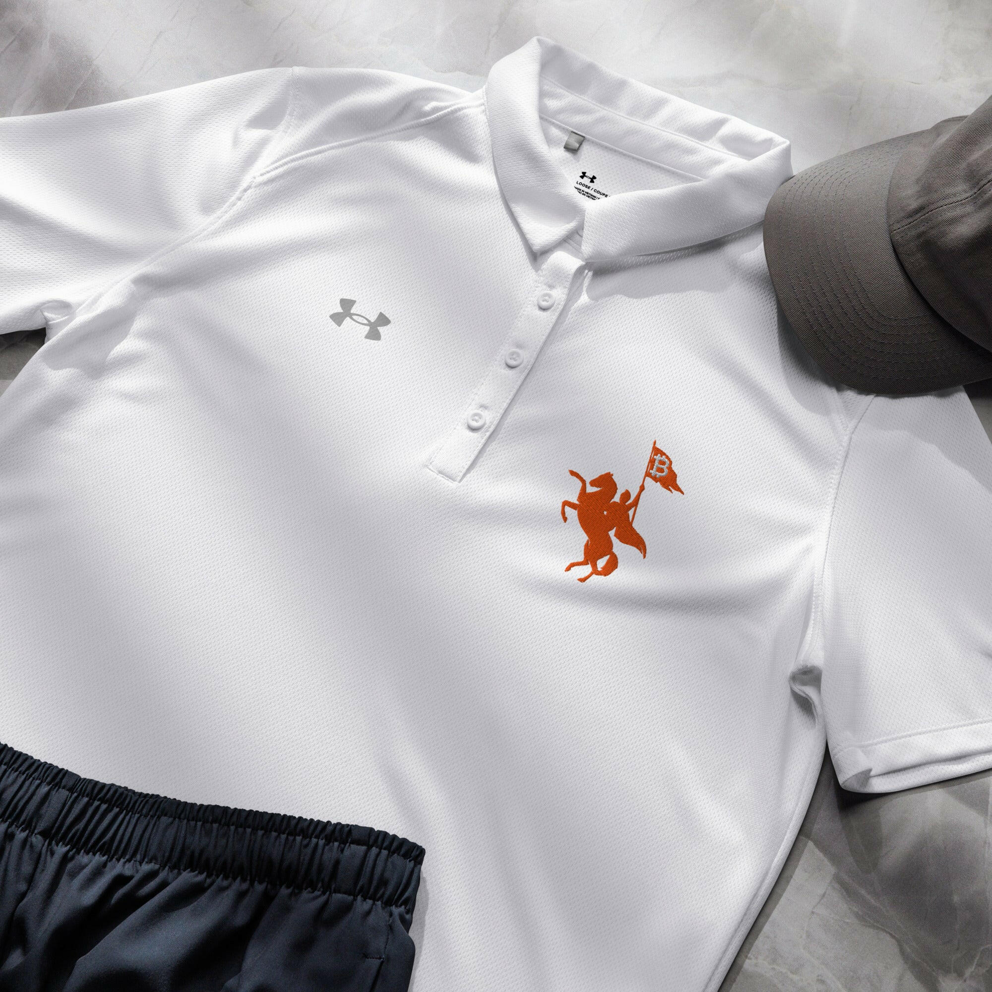 Soft Revolution / Under Armour® Women’s Bitcoin Polo - Nikki Nakamoto - The Orange Habit